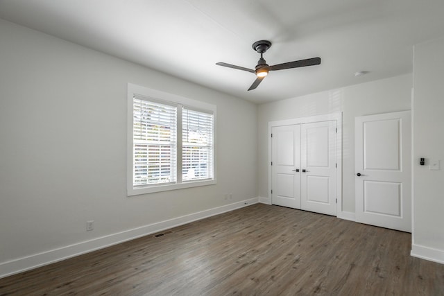 14 N Parkdale Ave, Chattanooga, TN 37411 - unfurnished bedroom featuring ceiling fan, baseboards, wood finished floors, visible vents, and a closet