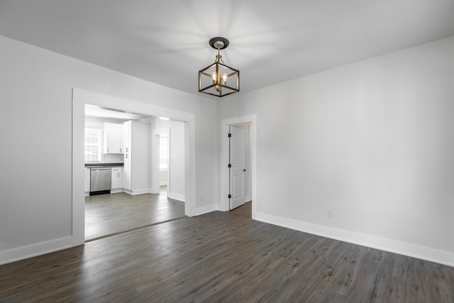 interior space featuring a notable chandelier and dark hardwood / wood-style floors