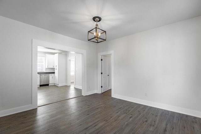 14 N Parkdale Ave, Chattanooga, TN 37411 - unfurnished dining area featuring baseboards, dark wood finished floors, and a chandelier