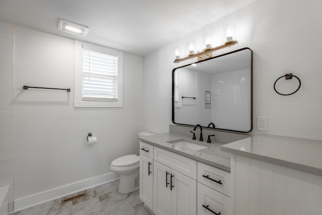 bathroom featuring vanity and toilet