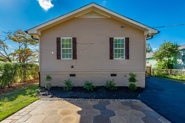 view of side of property with a patio area