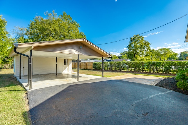 exterior space with a carport