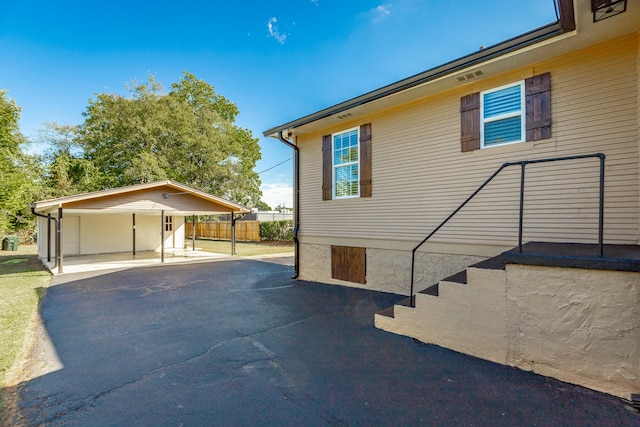 view of patio / terrace with a carport