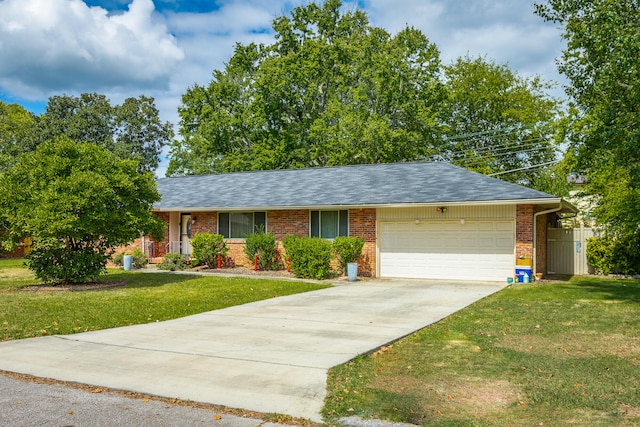 ranch-style home featuring a garage and a front lawn