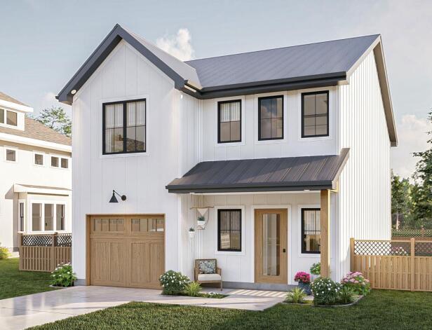 modern inspired farmhouse featuring a front yard and a garage