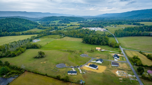 drone / aerial view with a mountain view and a rural view