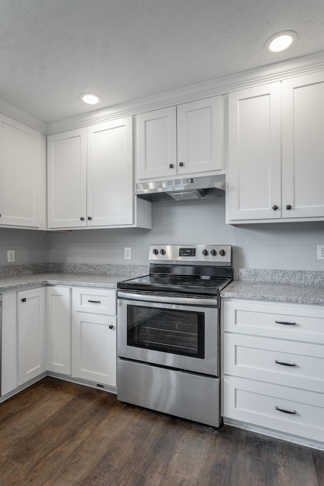 kitchen with white cabinets, dark hardwood / wood-style floors, light stone counters, and electric stove