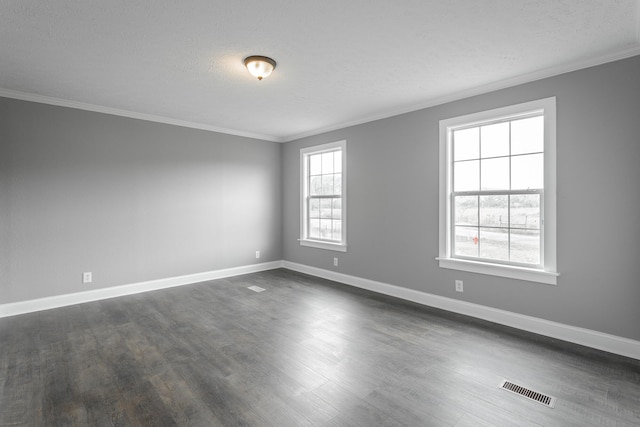 unfurnished room featuring dark wood-type flooring, a textured ceiling, and ornamental molding