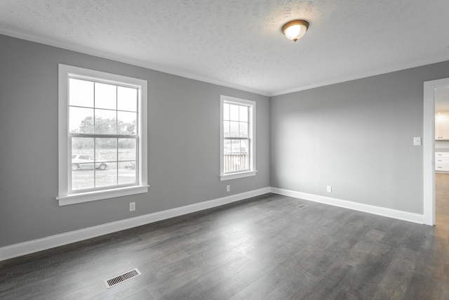 unfurnished room featuring ornamental molding, a textured ceiling, and dark wood-type flooring