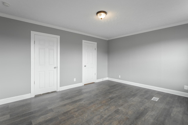 unfurnished bedroom with crown molding and dark hardwood / wood-style floors