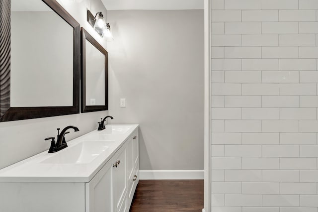 bathroom with vanity and hardwood / wood-style flooring