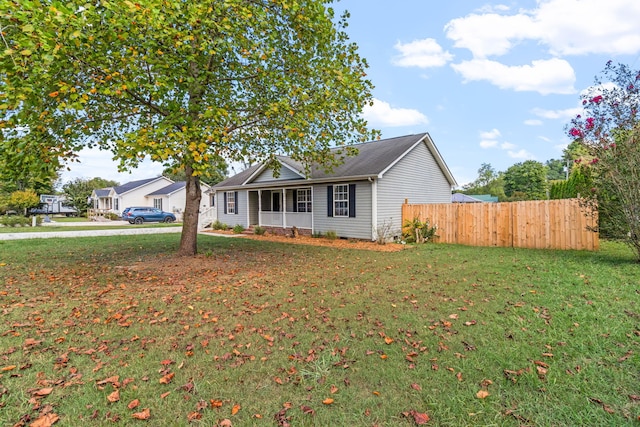 single story home featuring a front yard