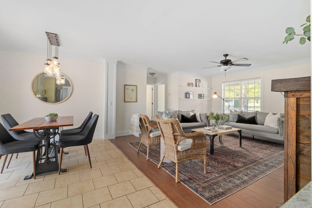 living room with ceiling fan, light tile patterned floors, and crown molding