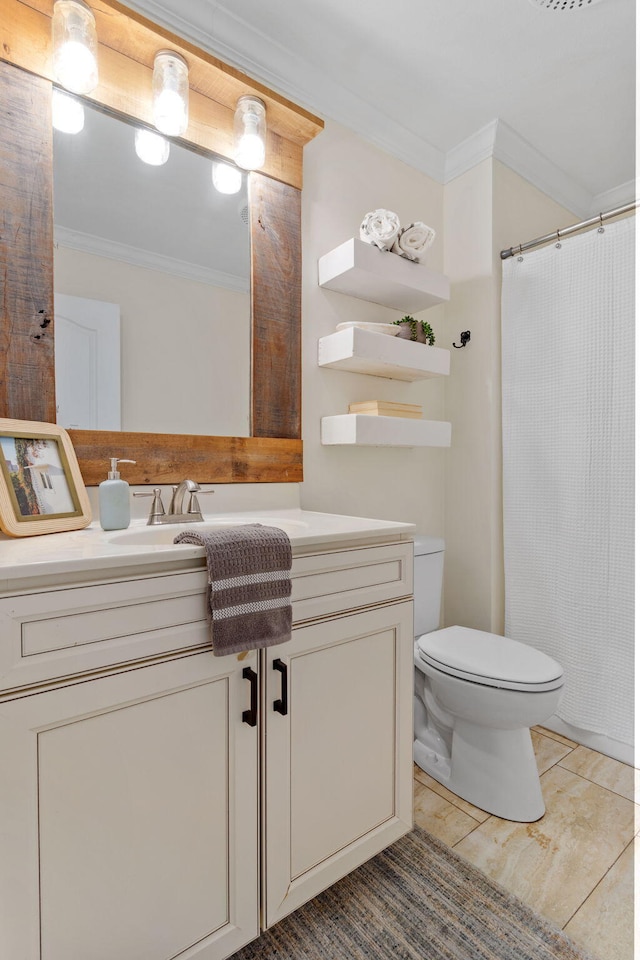 bathroom with crown molding, vanity, toilet, and tile patterned floors