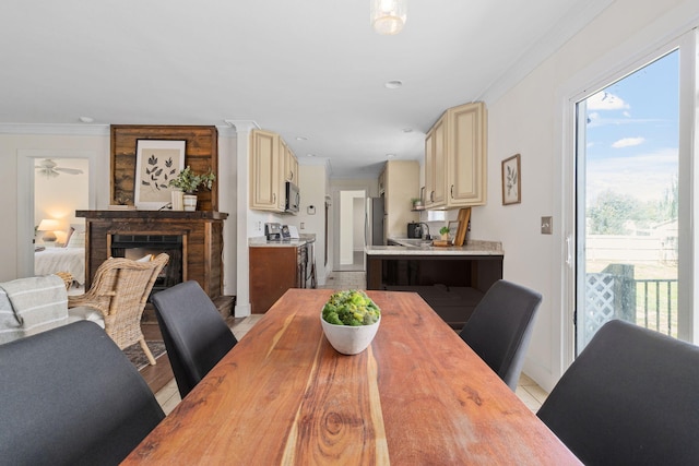 dining room featuring ceiling fan and ornamental molding