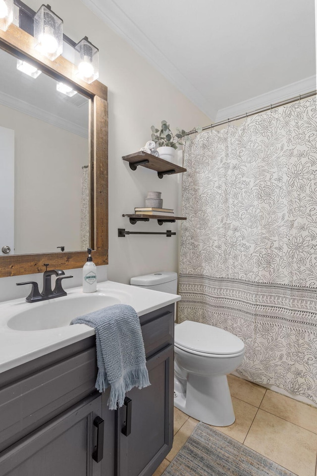 bathroom with ornamental molding, vanity, toilet, and tile patterned floors