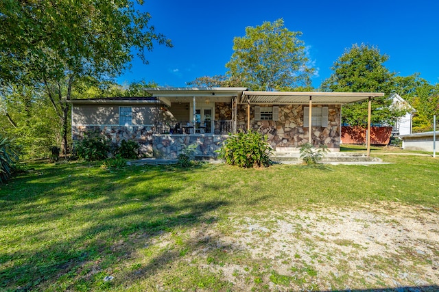 back of house featuring a porch and a lawn