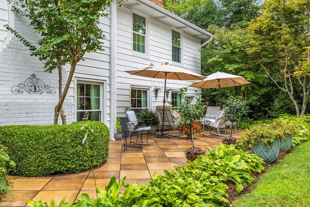 back of house with a patio