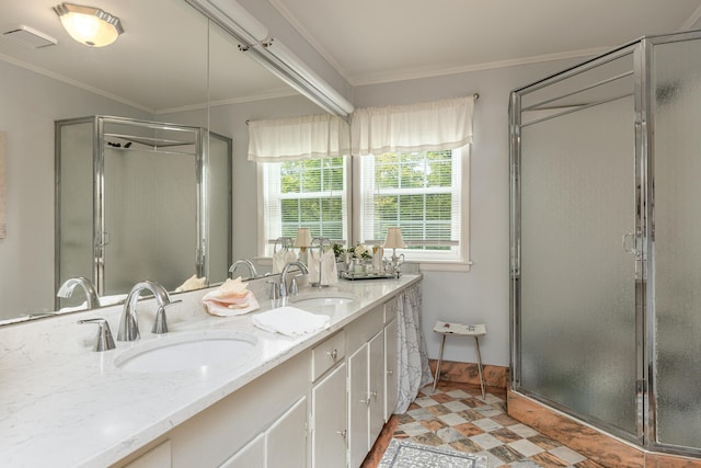 bathroom featuring crown molding, vanity, and a shower with door