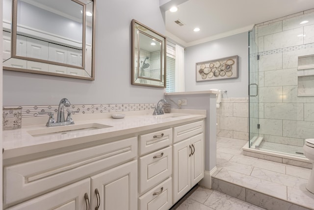 bathroom featuring walk in shower, ornamental molding, and vanity