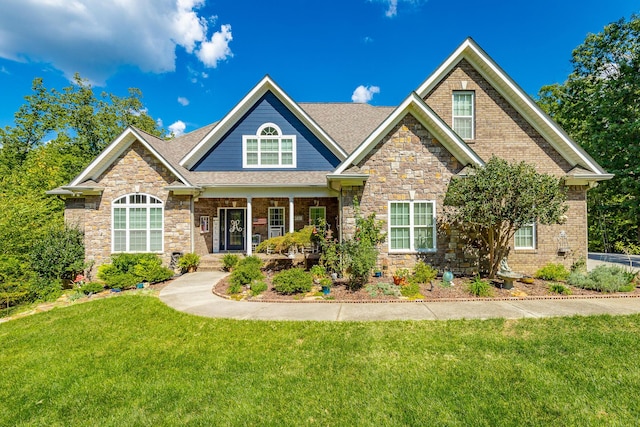 9731 Deer Ridge Dr, Ooltewah, TN 37363 - craftsman inspired home with a porch, stone siding, a front yard, and a shingled roof