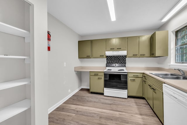 kitchen featuring sink, light hardwood / wood-style flooring, white appliances, and green cabinetry