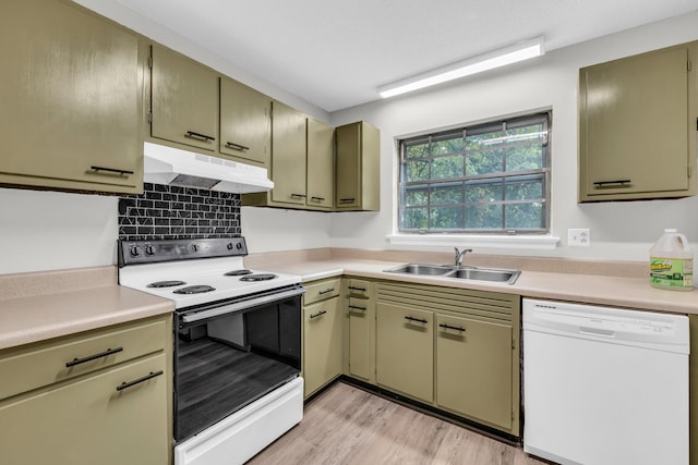 kitchen with sink, green cabinets, white dishwasher, range with electric stovetop, and light wood-type flooring