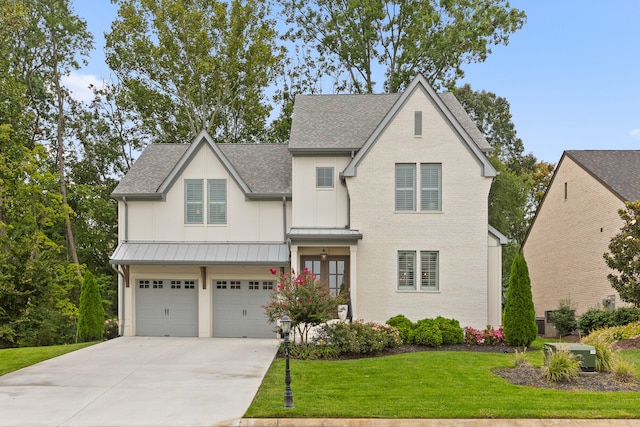 view of front of property with a garage, a front lawn, and central AC unit