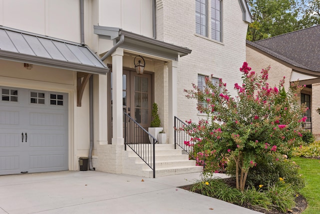 view of exterior entry with a garage