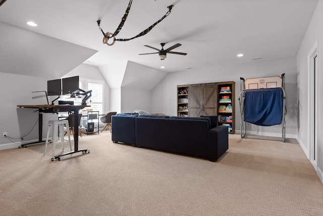 living room with ceiling fan, light carpet, and vaulted ceiling