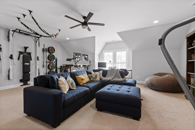 carpeted living room with vaulted ceiling and ceiling fan