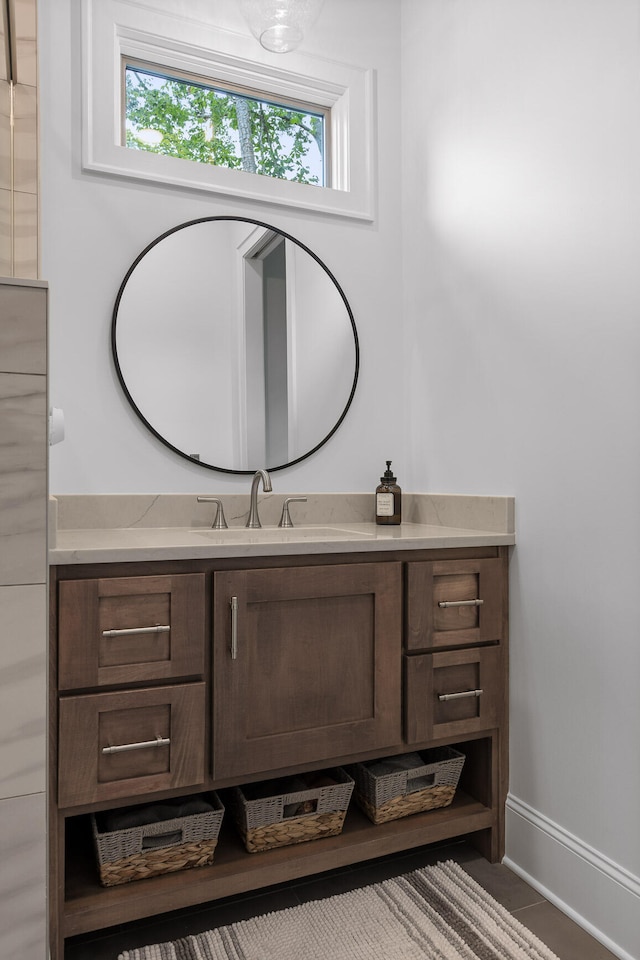 bathroom featuring vanity, tile patterned floors, and a healthy amount of sunlight