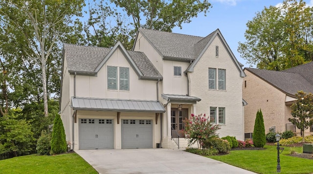 view of front facade featuring a garage and a front lawn