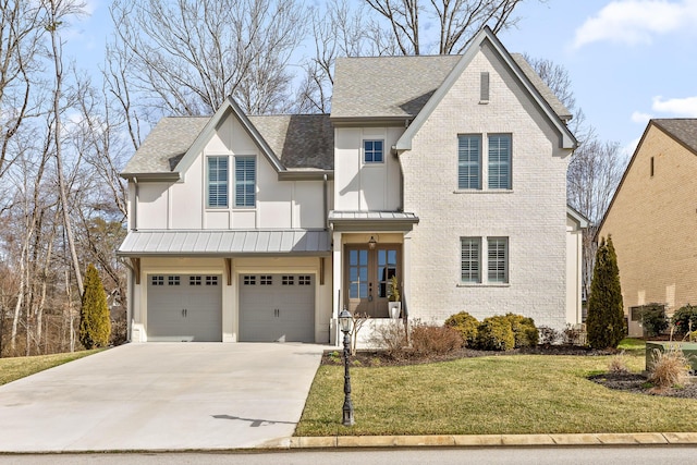 view of front facade with a garage and a front yard