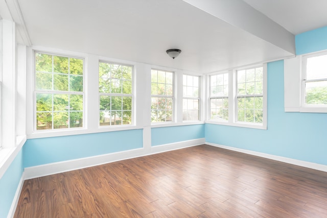 unfurnished sunroom with a wealth of natural light