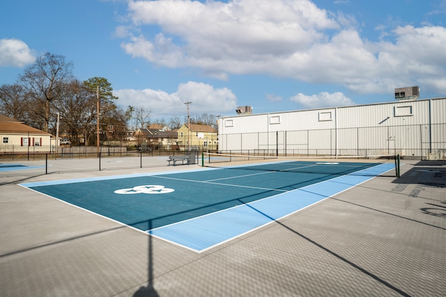 view of pool featuring tennis court