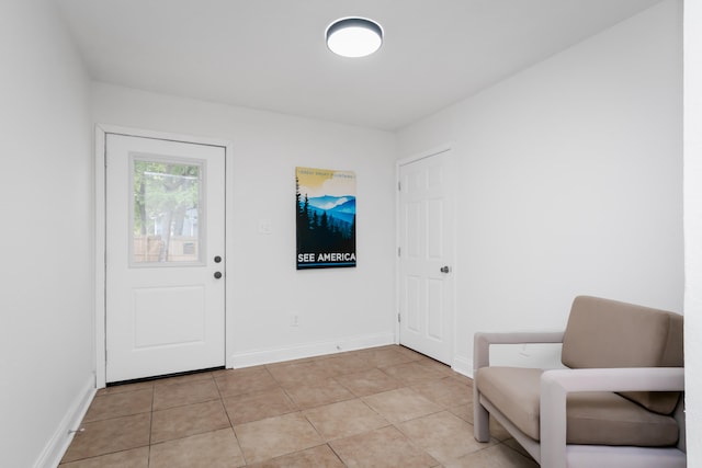 entrance foyer with light tile patterned floors