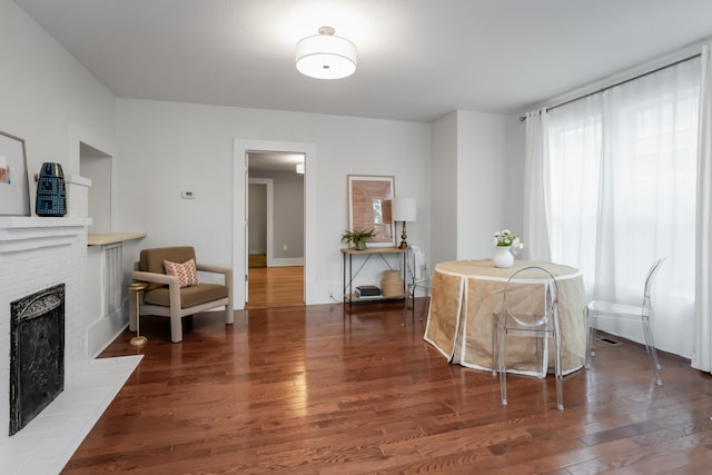 interior space featuring a fireplace and dark hardwood / wood-style flooring