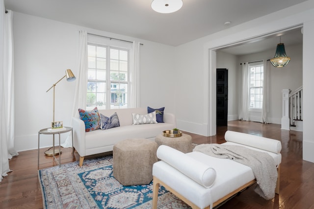 living room with dark hardwood / wood-style floors