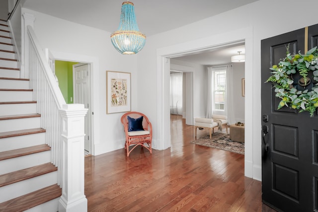 entrance foyer with a chandelier and dark wood-type flooring