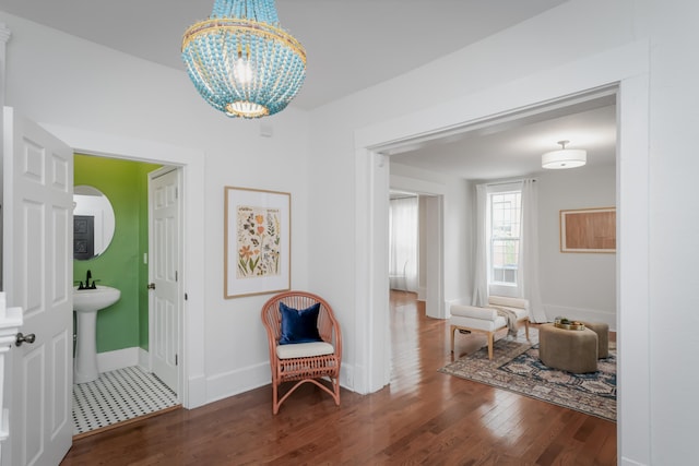 foyer featuring a notable chandelier and dark wood-type flooring