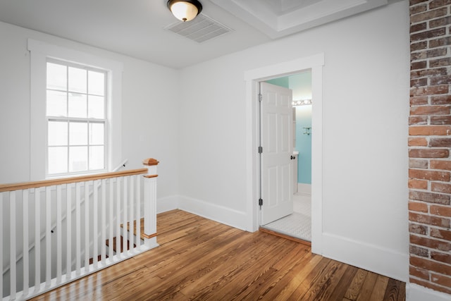 corridor featuring hardwood / wood-style flooring