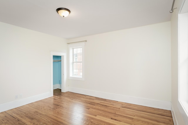 spare room with hardwood / wood-style floors