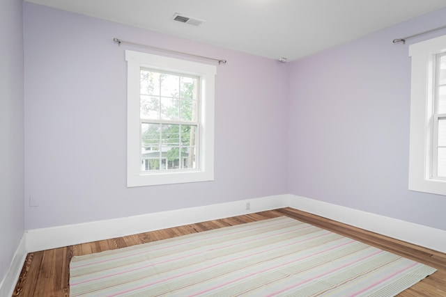 unfurnished room featuring hardwood / wood-style floors