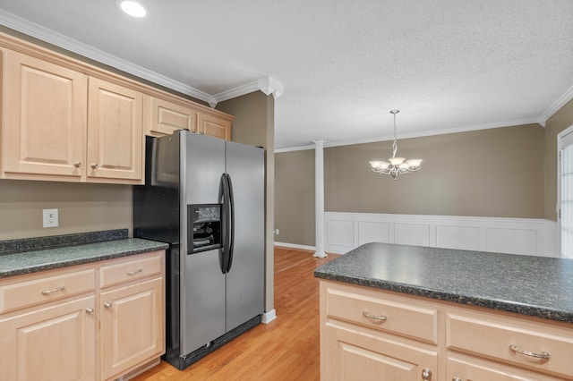 kitchen featuring hanging light fixtures, light hardwood / wood-style floors, crown molding, stainless steel refrigerator with ice dispenser, and a notable chandelier