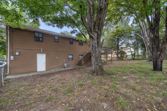 back of property featuring a wooden deck and central air condition unit