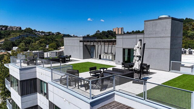 exterior space featuring a lawn and an outdoor living space