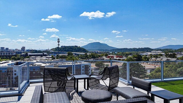 wooden deck with a mountain view