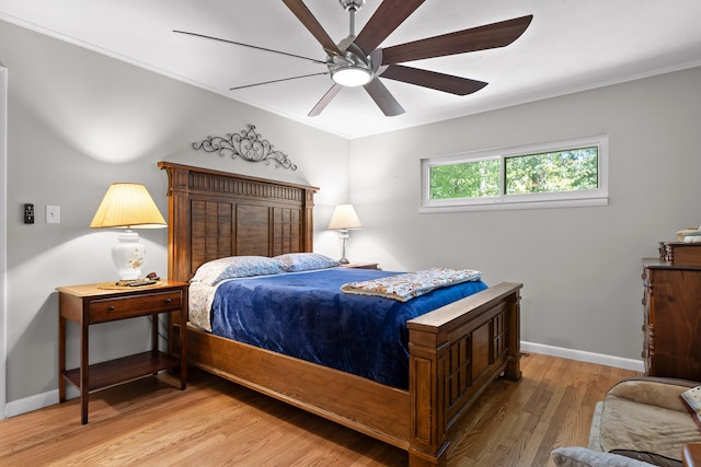 bedroom featuring ceiling fan and hardwood / wood-style flooring