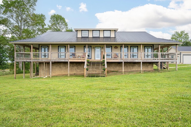 rear view of property featuring a yard